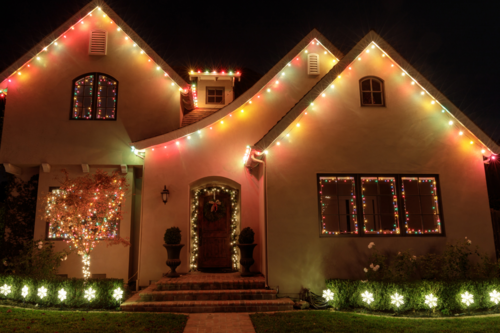 Christmas lights beautifully installed on a charming home photographed at night to highlight the holiday display.