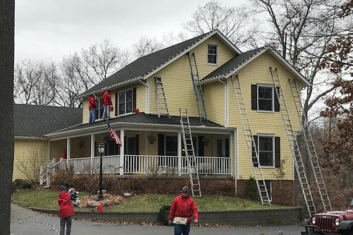Experienced Christmas light installers working on Ann Arbor home